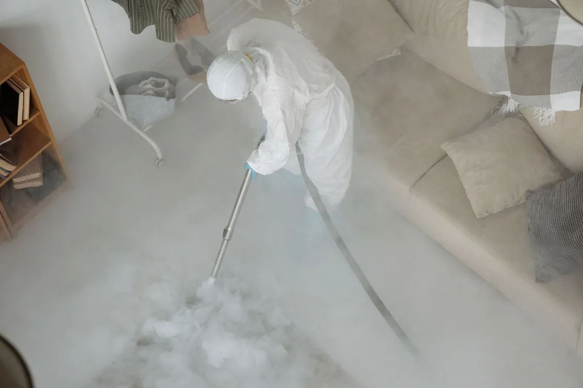 Biohazard cleanup technician in protective equipment, Shepherdsville, KY
